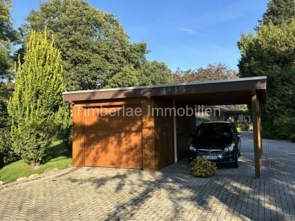  Charmanter Flachdachbungalow mit 2 Ferienwohnungen – Traumhafte Gartenanlage nahe dem Timmeler Meer