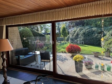  Charmanter Flachdachbungalow mit 2 Ferienwohnungen – Traumhafte Gartenanlage nahe dem Timmeler Meer